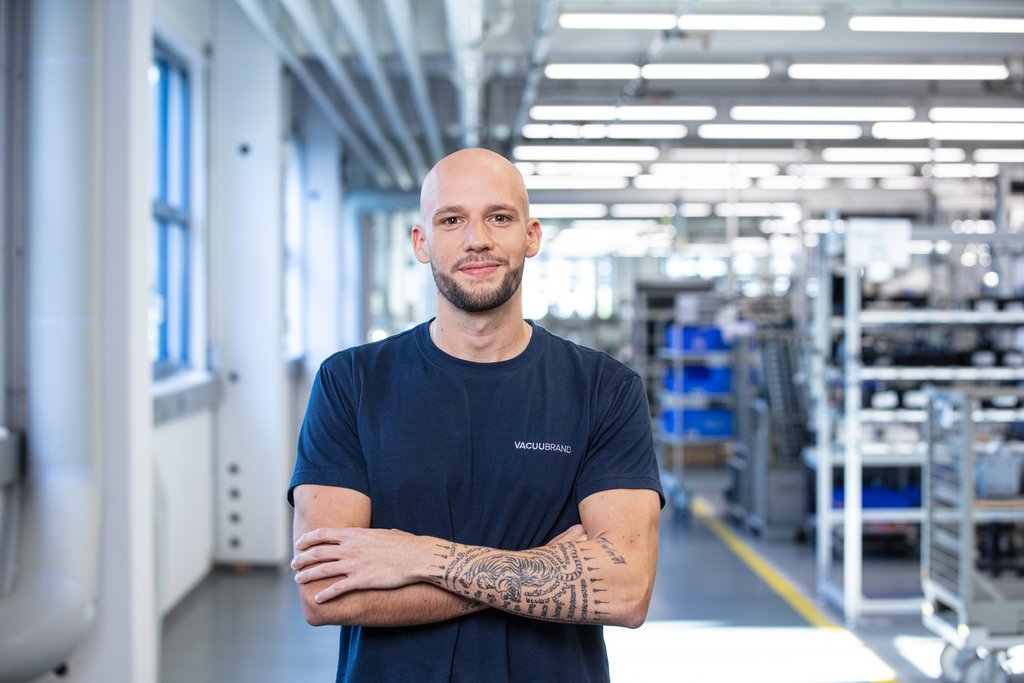 Male employee is looking into the camera